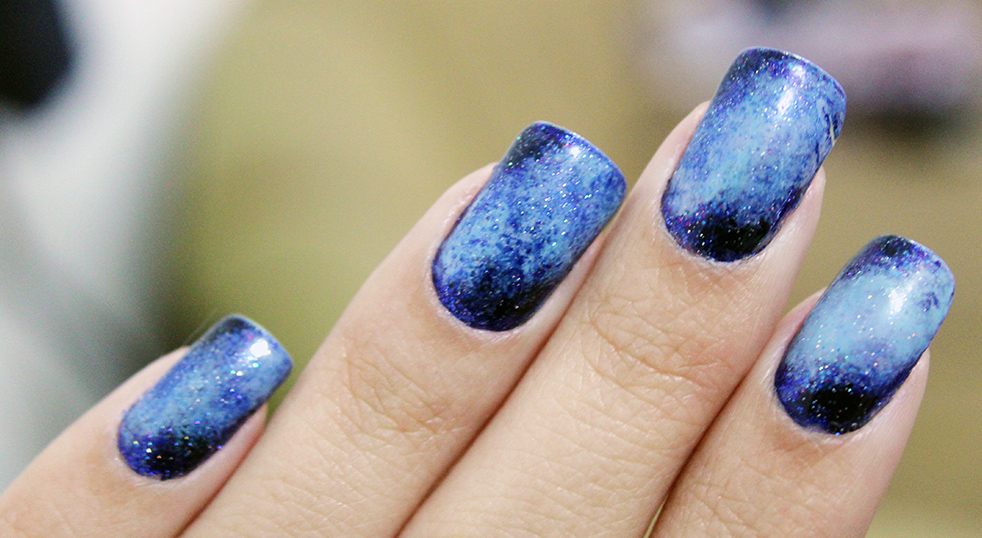 Colorful galaxy-style nail art design